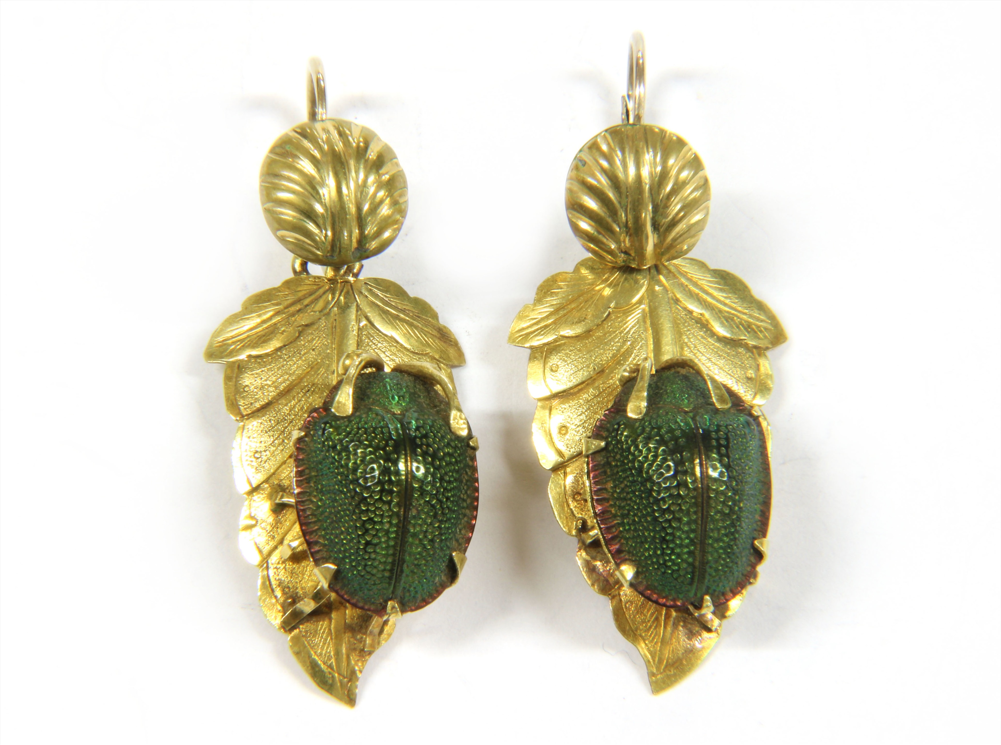 A pair of Victorian gilt metal earrings set with real scarabs (the actual beetles preserved) Upcoming in Jewellery, Silver & Luxury Goods Sale, 8th April 2020, together with a 20thcentury faience ring and a section of scarab beetle bracelet Estimate £100-200